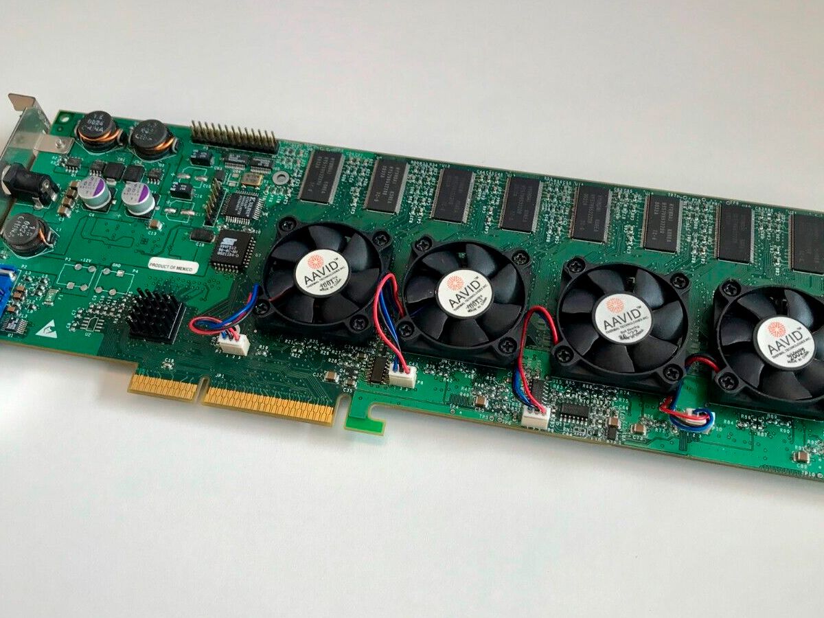 An oversized multi-chip 3D graphics card with four processors and an external power brick, displayed like a museum piece, evoking the unreleased Voodoo 5 6000
