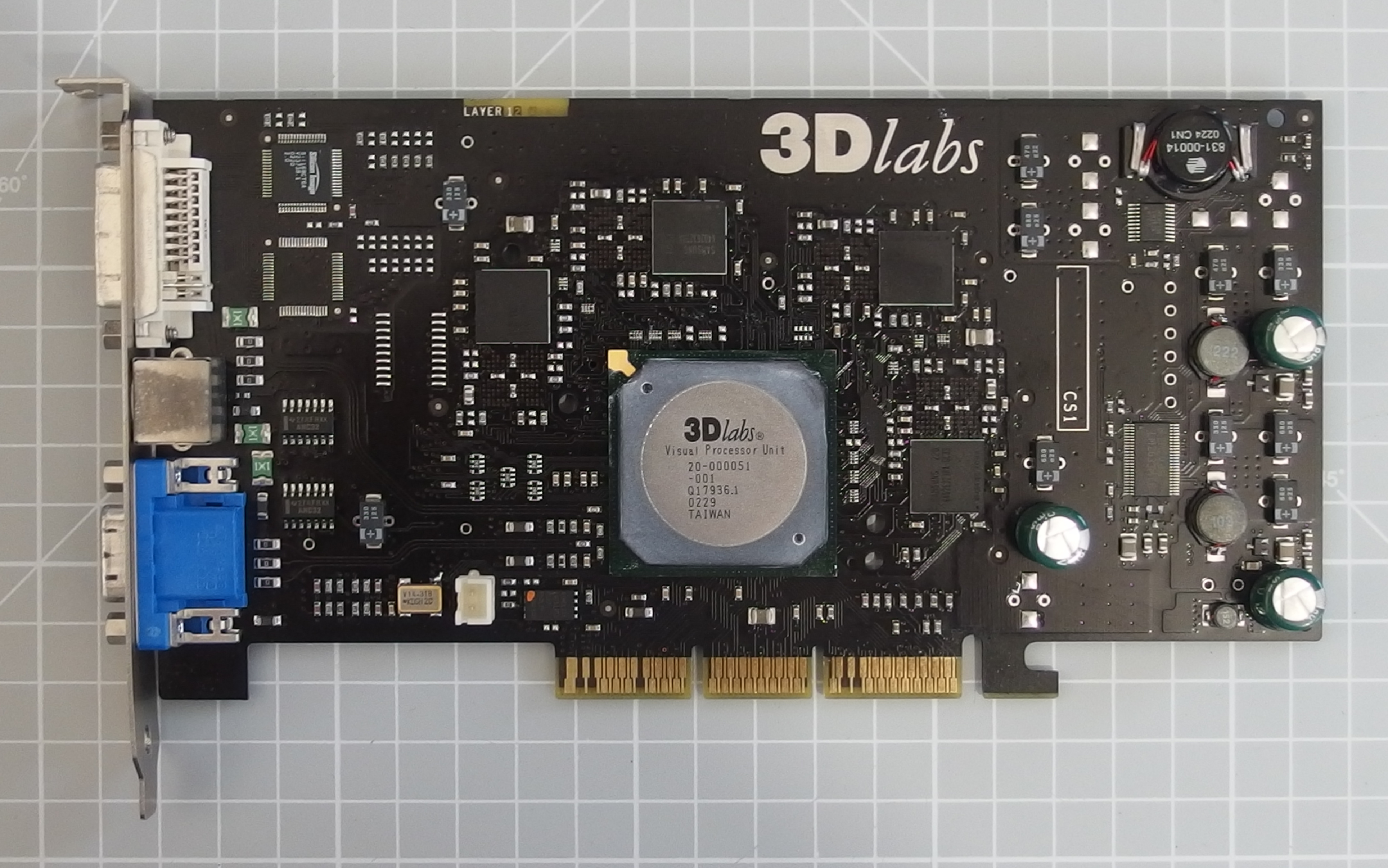 A vintage professional GLINT-era graphics card with a large central processor on a green circuit board.