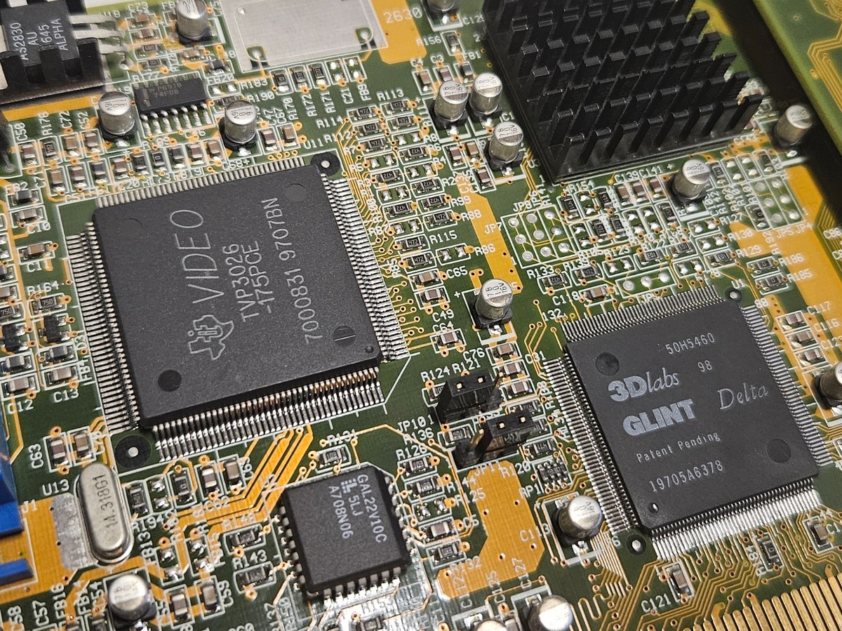 Macro photograph of a vintage 3Dlabs GLINT graphics processor, the single chip at the centre of the first-GPU debate.