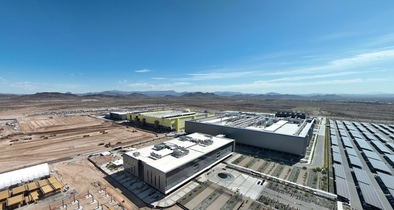 An aerial view of TSMC's Arizona fab complex in the desert, part of its 165 billion dollar US expansion.